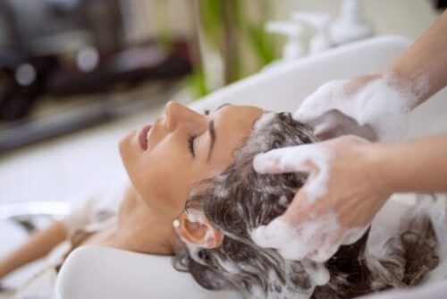 girl shampooing hair