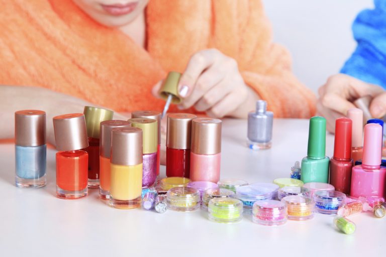 girls applying nail paint