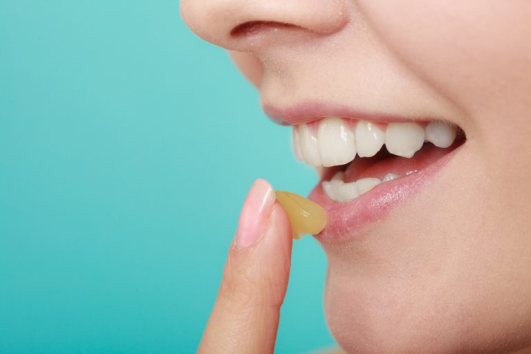 girl applying petroleum jelly