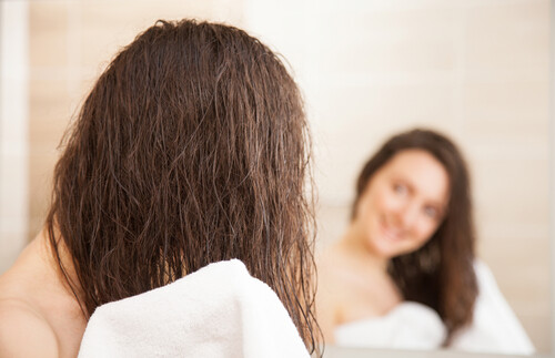 rubbing hair with a towel