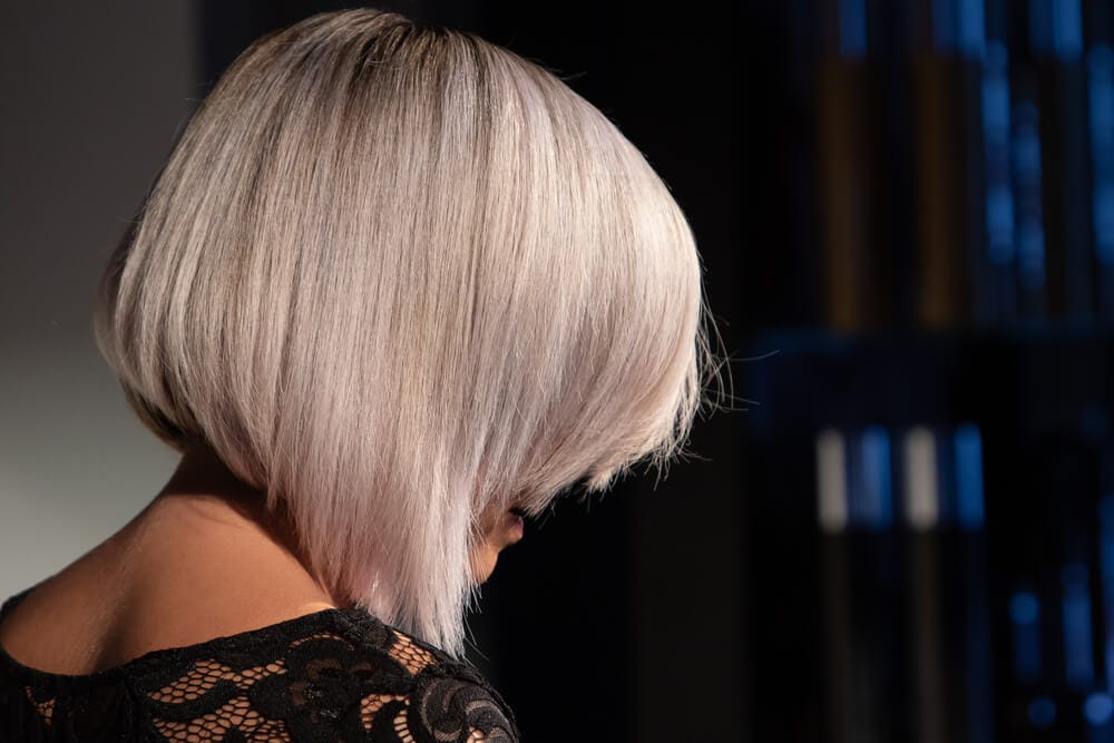 A woman with short platinum blonde hair.