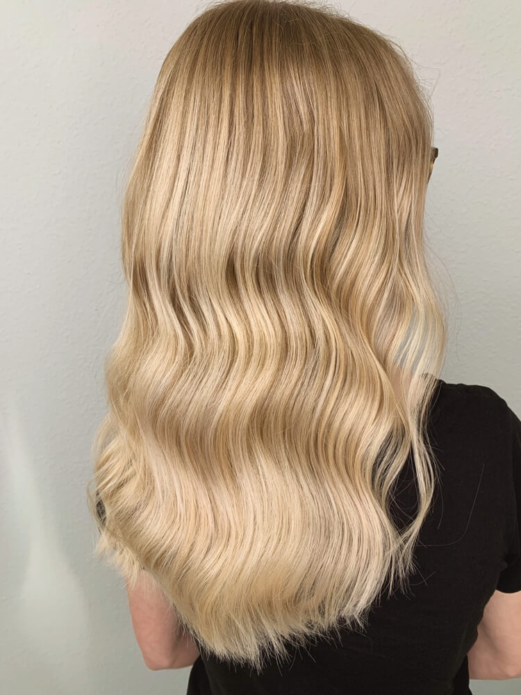 A woman with creamy blonde hair.