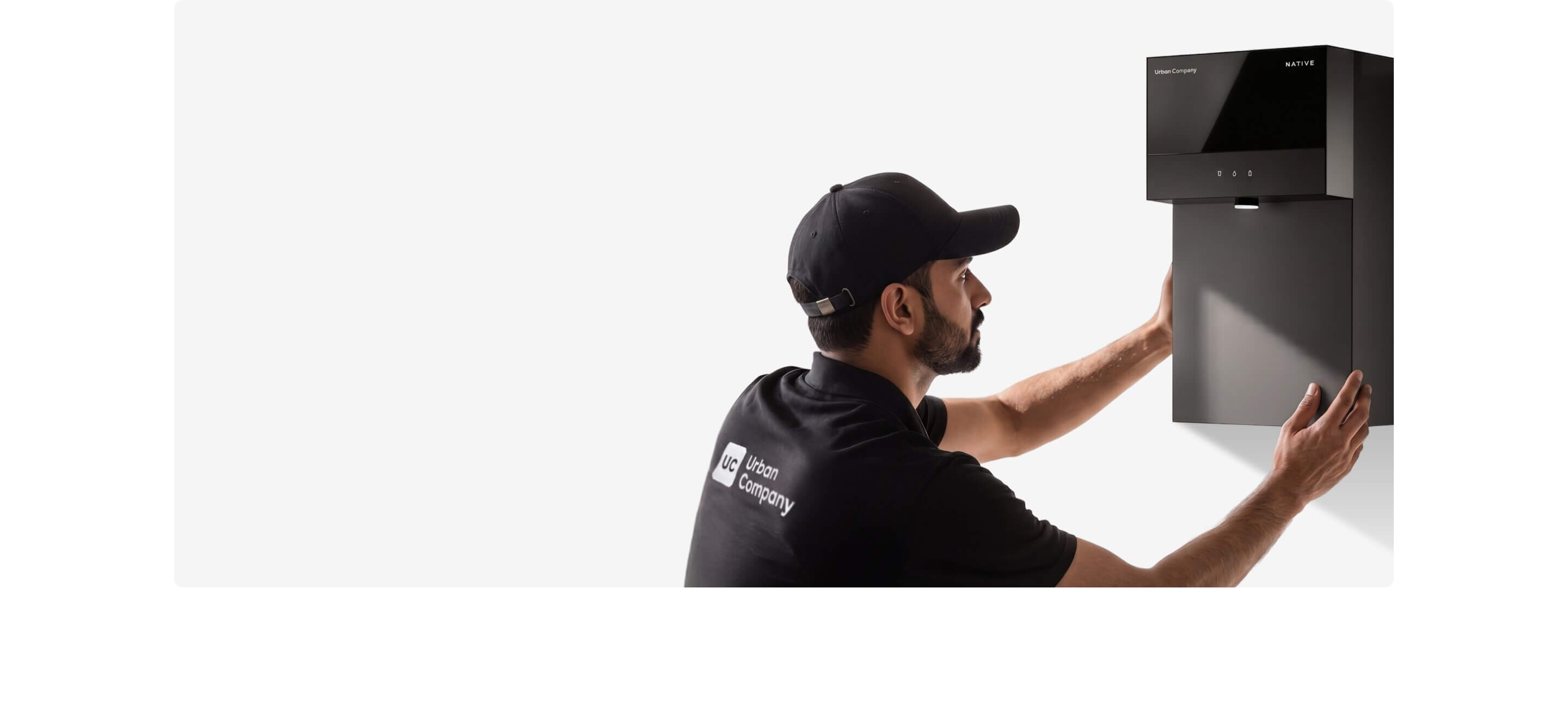 Urban Company professional installing a Native water purifier on a wall