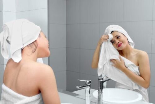 wiping face with a wet towel